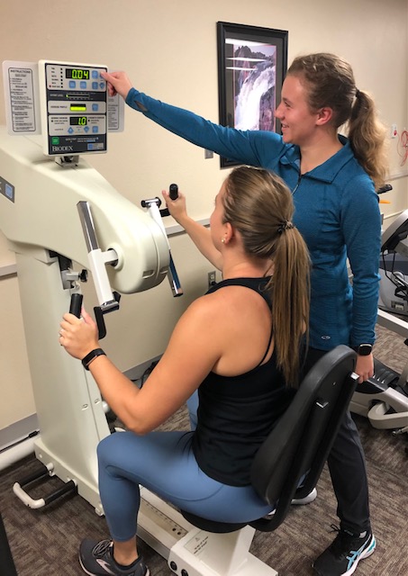 Image of Cancer Therapist Jen N. working with a patient Kinesio Tape Image